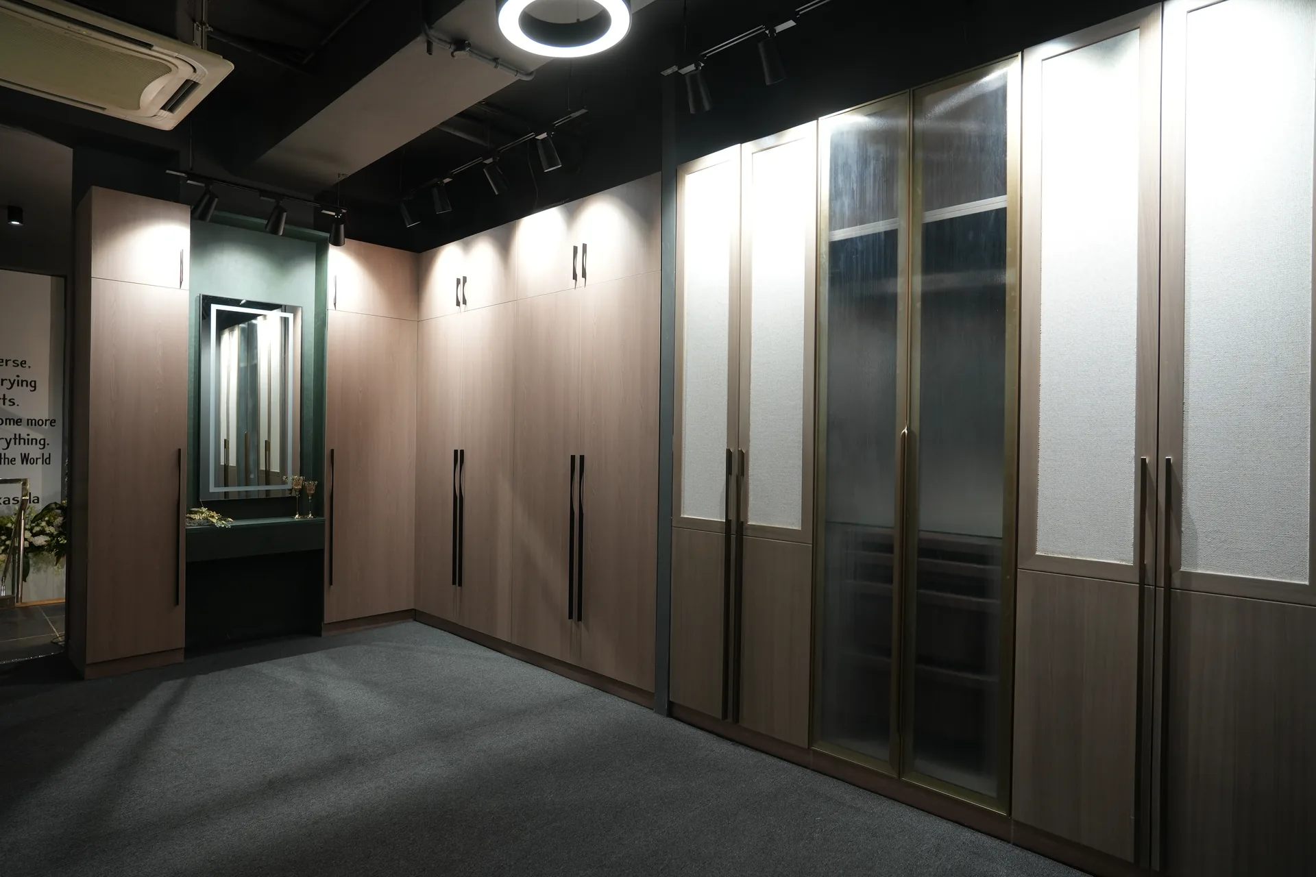 Wardrobe wall with light wood shutters and fluted glass doors at the SALT Experience Centre