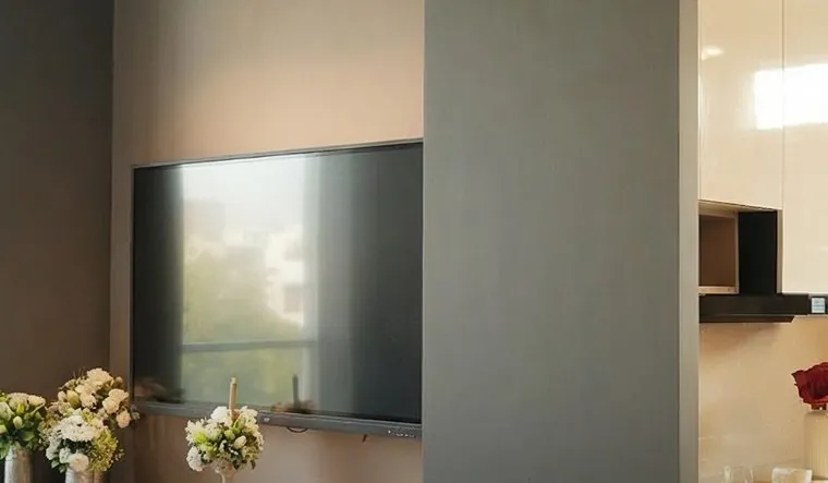 Wall-mounted TV unit with concealed storage at the SALT Experience Centre